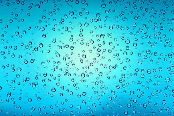 Beautiful blue water drops on glass - Photo, Image