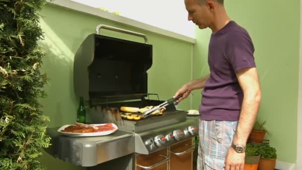 father at barbecue grill - Video