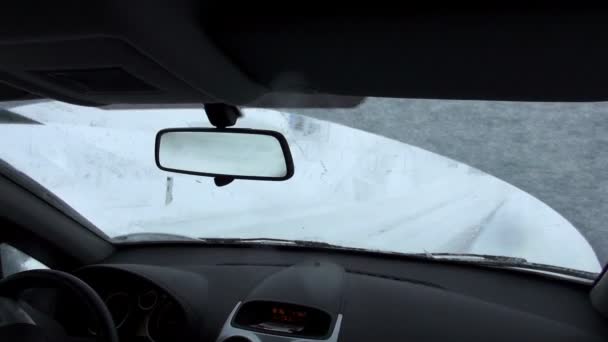 view from front seat of car on snow covered road - Imágenes, Vídeo