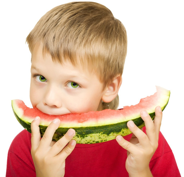 Boy eating a piece of watermelon - Zdjęcie, obraz