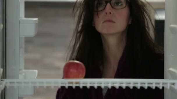 woman taking apple from fridge  - Felvétel, videó