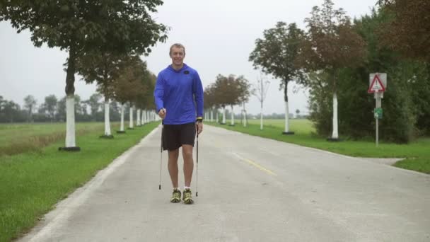 nordic walking slow motion on cloudy day - Footage, Video