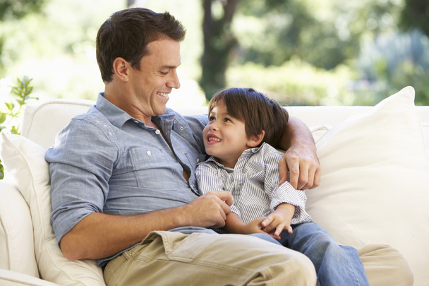 Father And Son Sitting On Sofa  - Photo, image