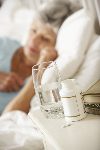 Medication On Bedside Table Of Sleeping Woman - Foto, Imagem