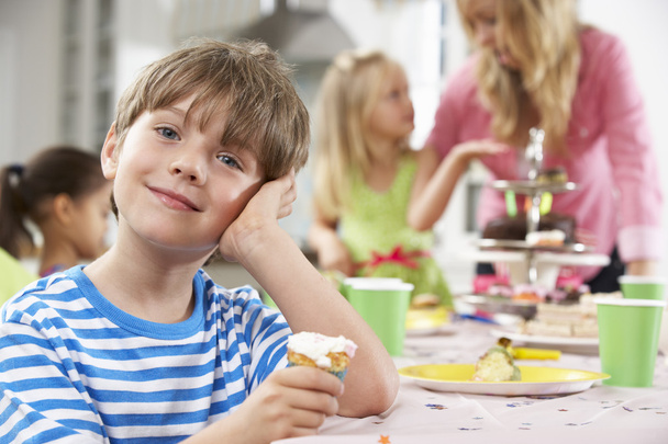 Children Enjoying Birthday Party Food At Table - Фото, изображение