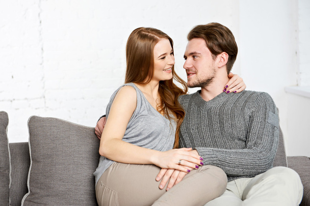 Young couple on the sofa - Photo, image