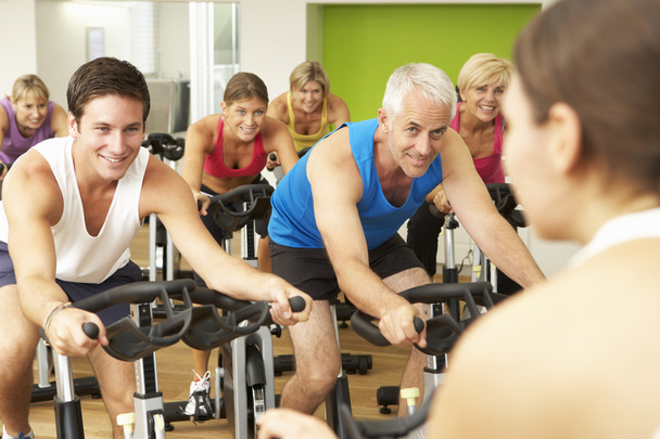 Group of People Exercising In Spinning Class - Foto, Bild