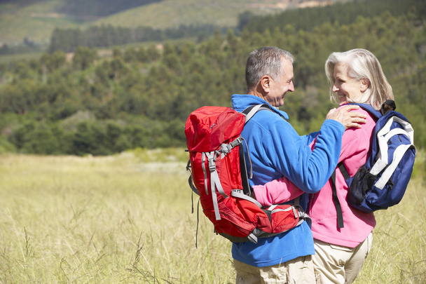 Senior Couple On Hike Through Countryside - Fotoğraf, Görsel