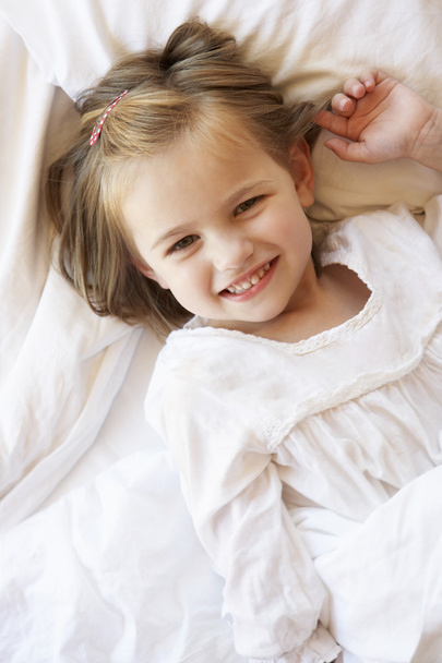 Young Girl Relaxing In Bed - Photo, Image