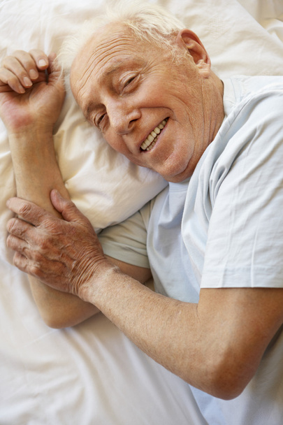 Senior Man Relaxing In Bed - Zdjęcie, obraz