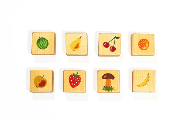 Wooden cubes with fruits separately - Photo, Image