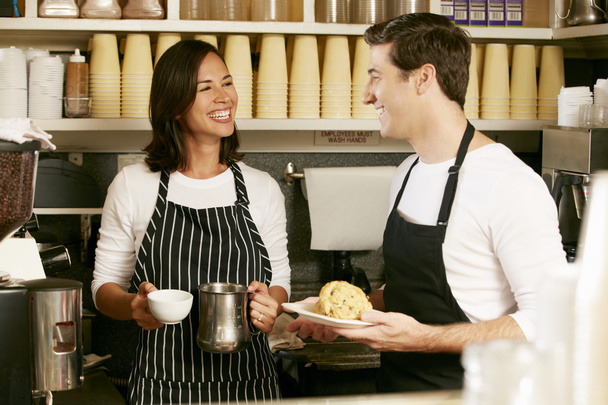 Man And Woman Working In Coffee Shop - Фото, зображення