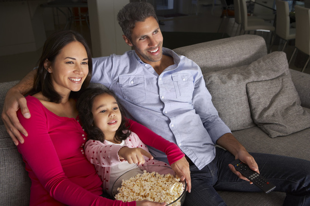 Family Sitting On Sofa And Watching TV  - Foto, Imagen