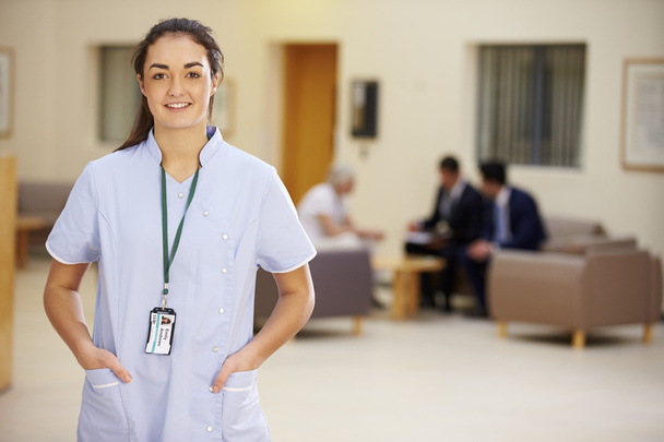 Female Nurse In Hospital Reception - Foto, imagen