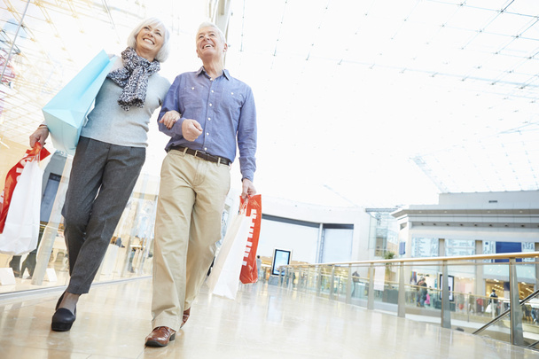 Happy Senior Couple In Shopping Mall - Photo, Image