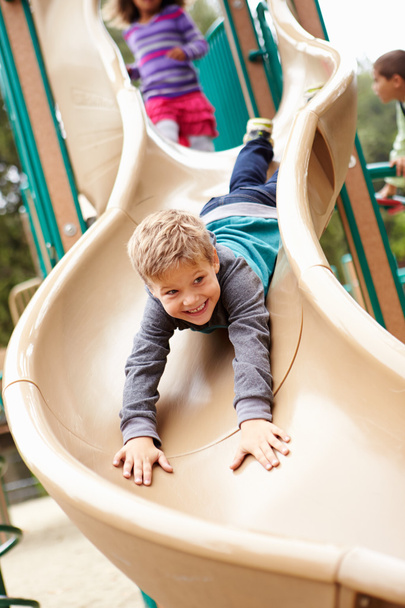 Young Boy Playing On Slide - Fotoğraf, Görsel