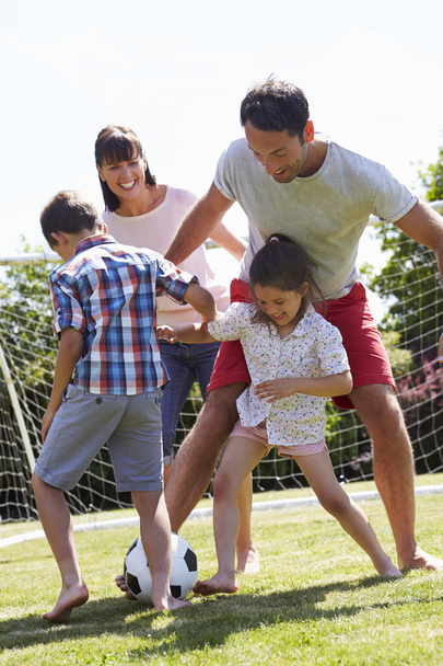 Family Playing Football In Garden  - Photo, image