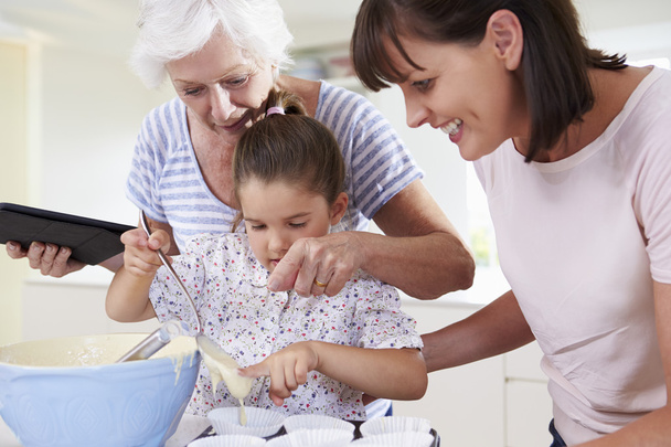 Grandmother, Granddaughter And Mother Baking Cake - Фото, зображення