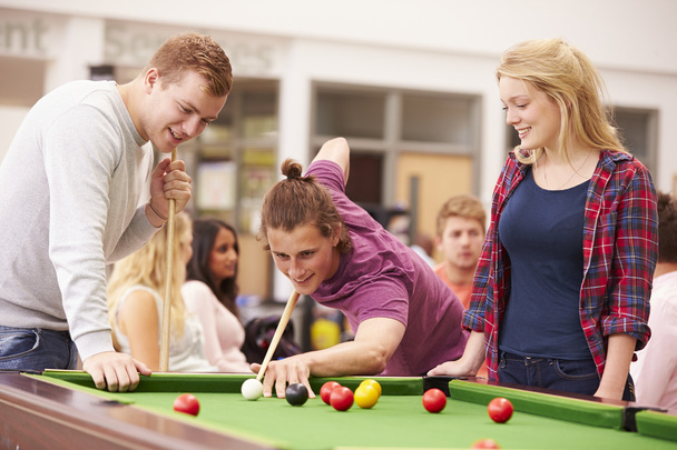 Students Relaxing And Playing Pool - Фото, изображение