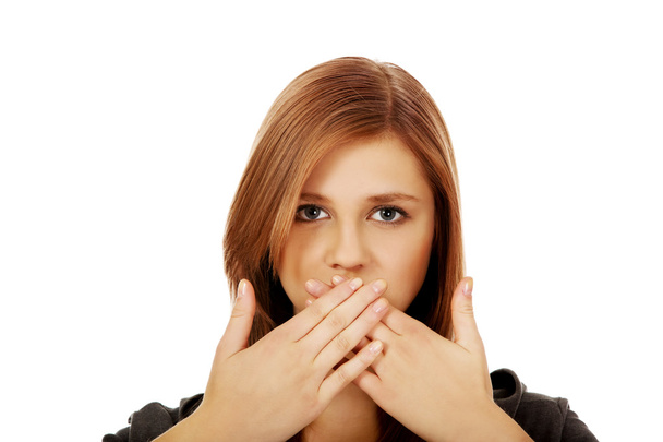 Teen woman covering her mouth with both hands - Foto, Imagem