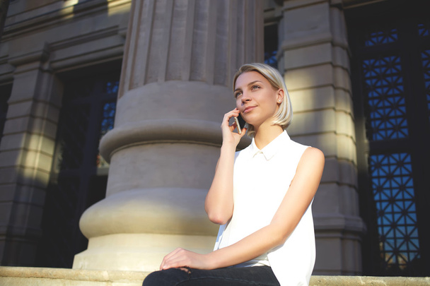 Woman relaxesand talks by cell telephone - Fotó, kép