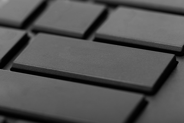 Zwarte computertoetsenbord met lege knoppen - close-up - Foto, afbeelding