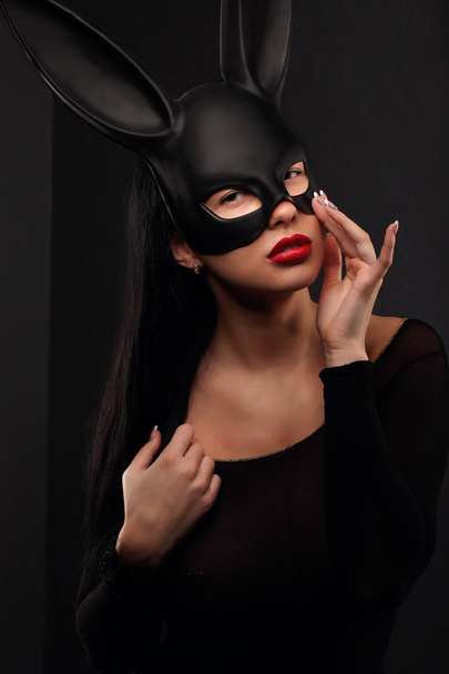Sexy, beautiful, charming, woamn in black rabbit mask and elegant dress. - Photo, Image