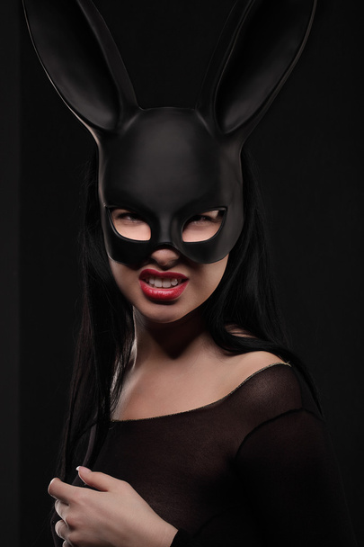 Sexy, beautiful, charming, woamn in black rabbit mask and elegant dress. - Foto, Imagen