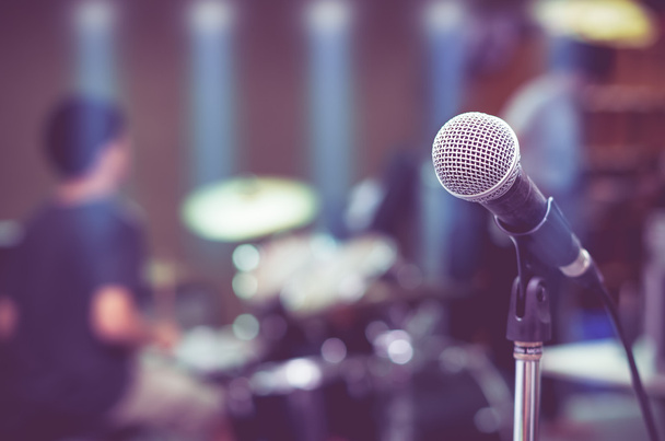 Close up of microphone on musician blurred background - Photo, Image