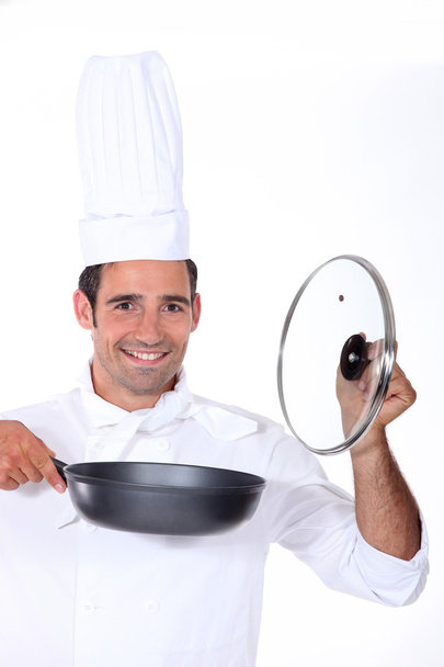 Chef holding a deep pan and glass lid - Fotoğraf, Görsel