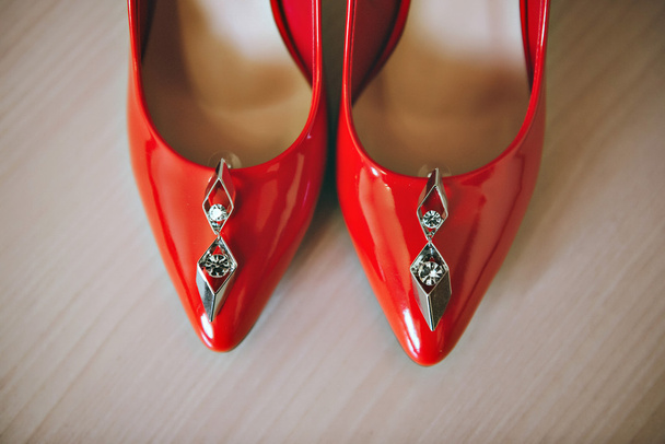 Red shoes and earrings - Фото, зображення