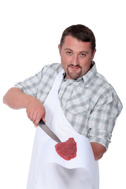 Butcher holding fresh meat - Foto, Bild