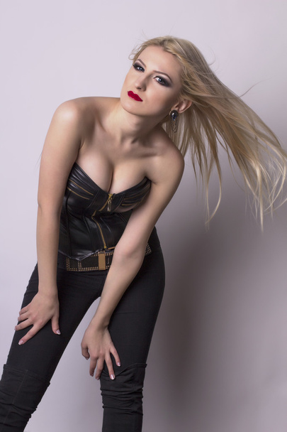 Beautiful blonde woman posing in a corset - Zdjęcie, obraz