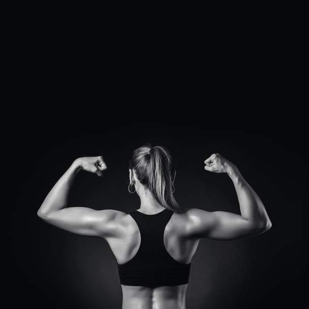 Muscular fitness woman, back view - Zdjęcie, obraz