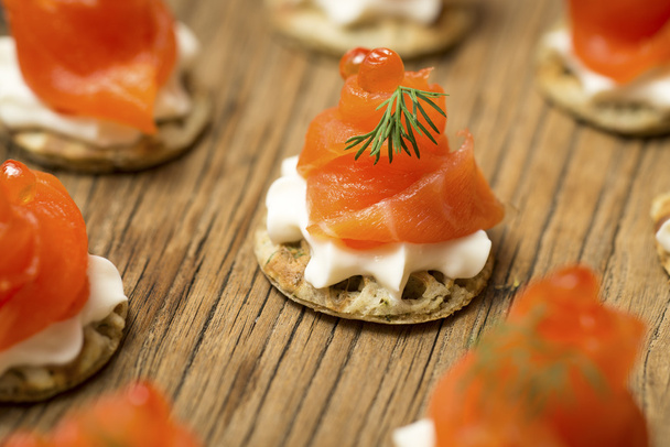 Smoked Salmon Blinis on a wooden table - Photo, Image