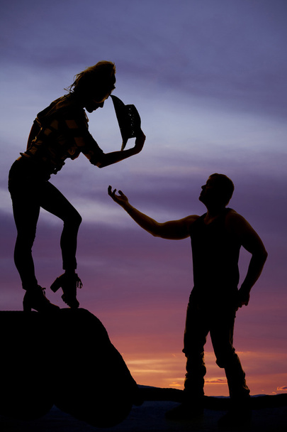 silhouette of man hand reaching up to a woman - Foto, Bild