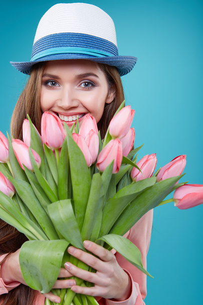 woman with tulips flowers - Фото, изображение