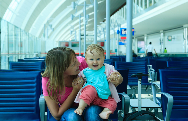 mother and little daughter waiting in the airport - Photo, Image