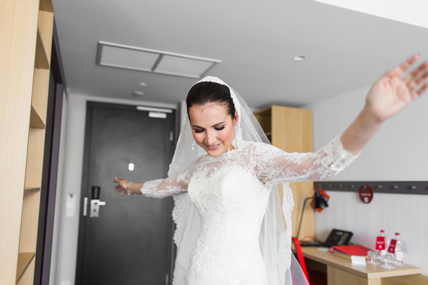 portrait of young gorgeous dancing bride indoors - Foto, Imagen