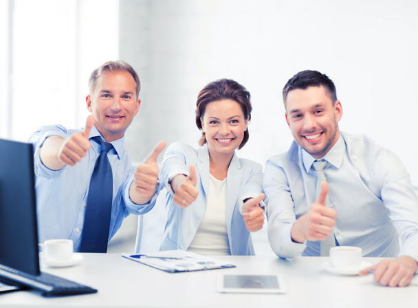 business team showing thumbs up in office - Foto, Imagen