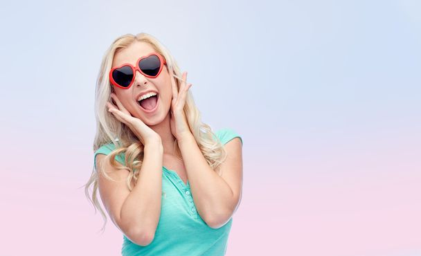 happy young woman in heart shape sunglasses - Zdjęcie, obraz