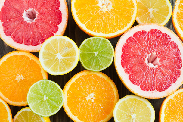 citrus color mix on a dark background - Foto, afbeelding