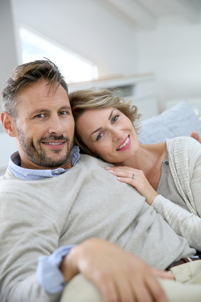 mature couple relaxing on couch - Photo, Image