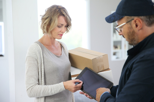 Woman receiving package - Photo, Image