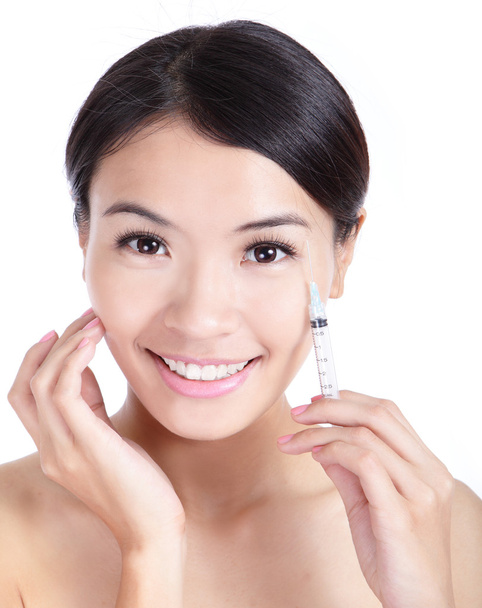 Cosmetic botox injection in woman face - 写真・画像