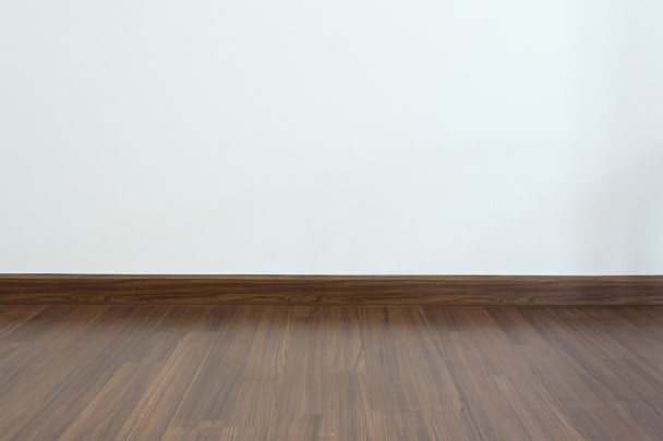 empty room, white mortar wall background and wood laminate floor - Photo, Image