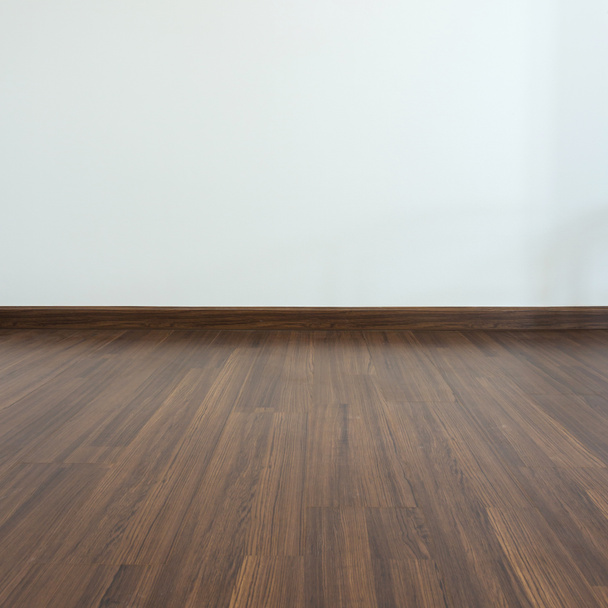 üres szoba, fehér habarcs háttér és laminált parketta - Fotó, kép