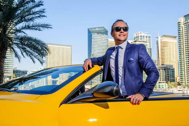 Successful yang businessman in yellow cabrio car - Photo, Image