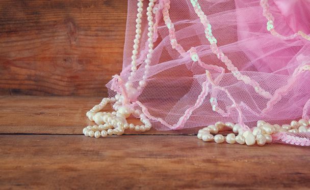 pearls and pink veil. wedding concept. vintage filtered and toned image. selective focus - Foto, afbeelding