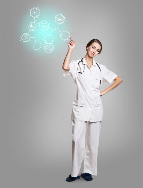 Médico femenino en hexágono táctil uniforme con iconos
 - Foto, Imagen